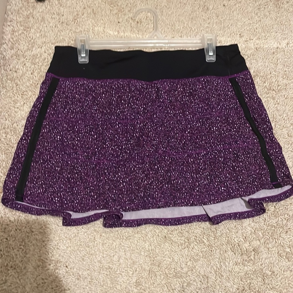Purple and black size 8 Lululemon tennis skirt with built in shorts.